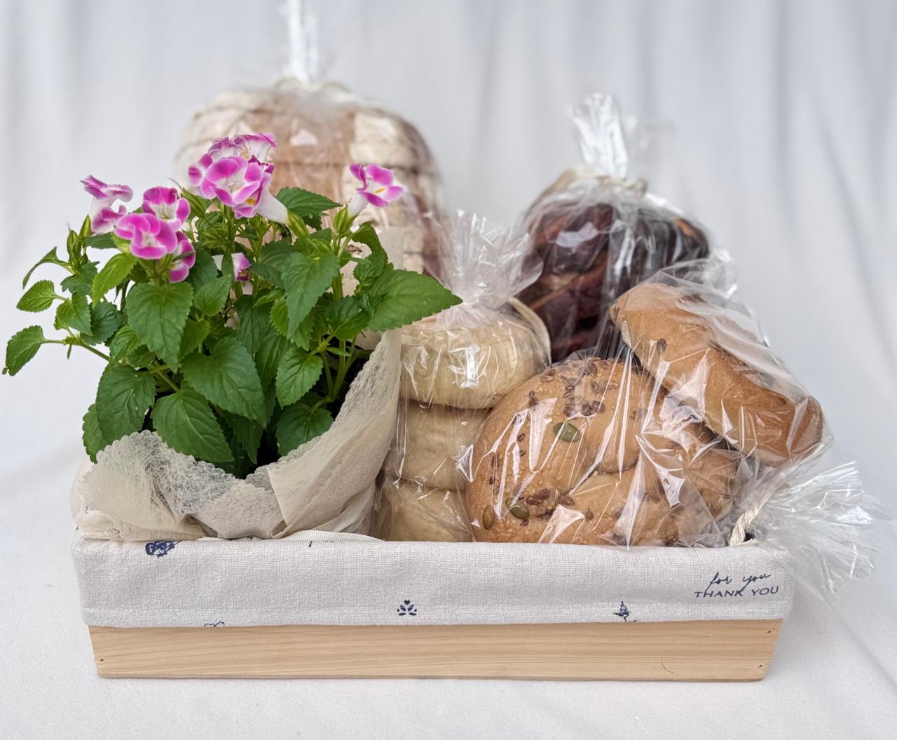 Felicidad Florecitas- ancheta con panes y flores Bogotá